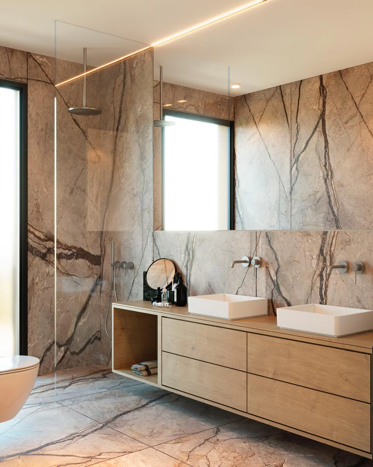 Modern bathroom with marble walls and floor, a wooden vanity with two square sinks, and a glass-enclosed shower.
