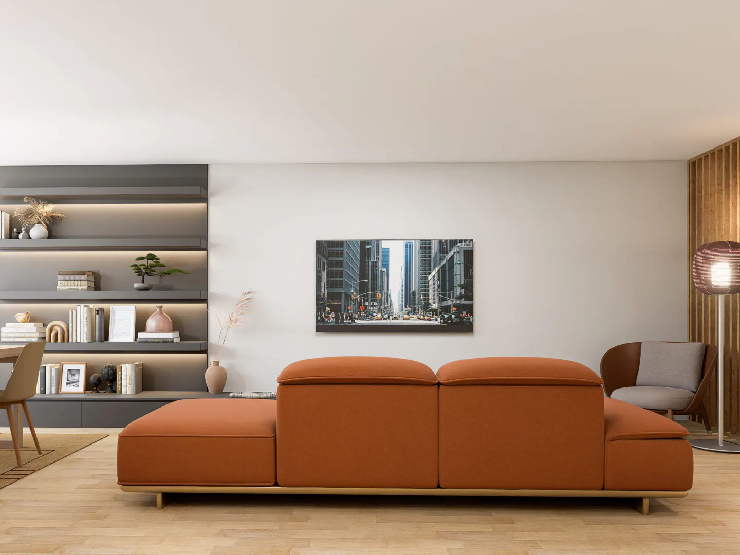 Modern living room with an orange sectional sofa, city print art, and built-in shelving with decor.
