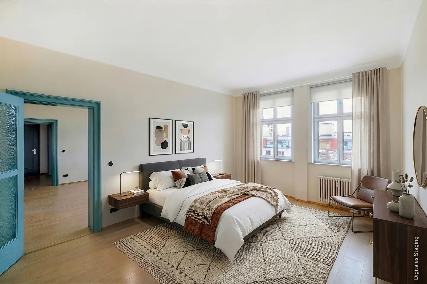 Bedroom with a gray bed, white linens, and a brown throw blanket. Two windows with beige curtains and a blue door frame are visible.