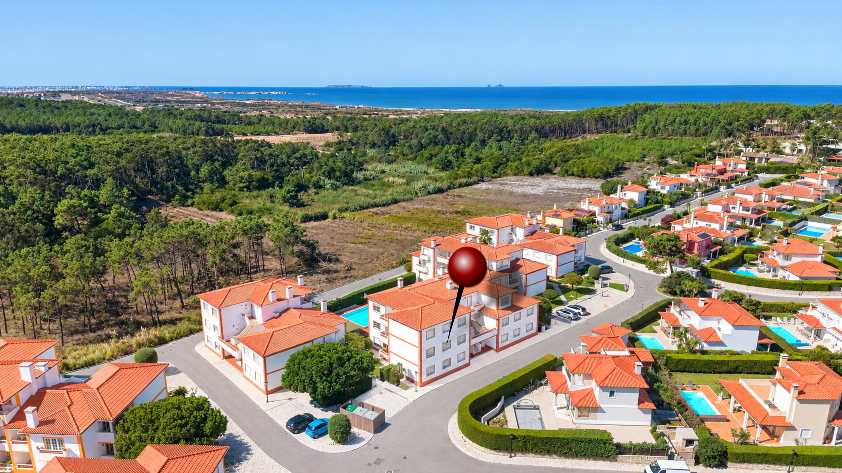 Aerial view of a coastal residential complex with white buildings, orange roofs, and swimming pools near a pine forest. [AI-generated text]