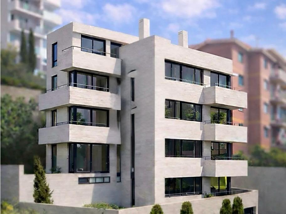 Modern multi-story apartment building with light stone facade, glass balconies, and large windows against a blue sky.