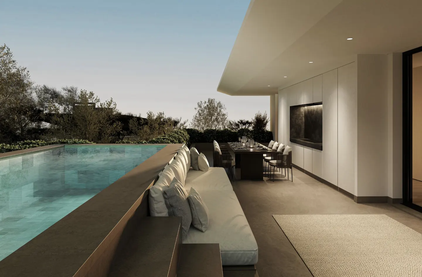 Outdoor patio with a pool, dining table, and lounge area. The pool is turquoise, and the lounge has white cushions. The dining table is set for a meal.