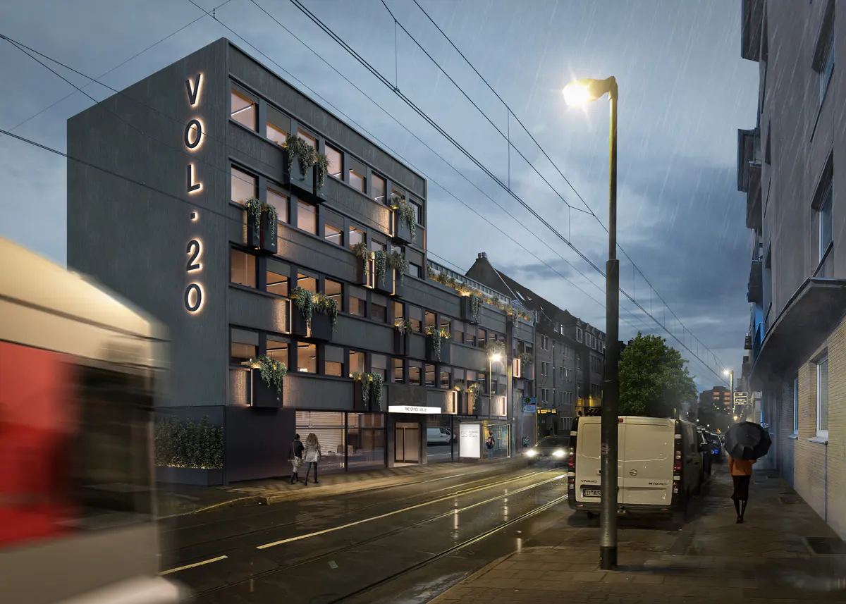 Exterior view of VOL.20 building on a rainy day, with a tram passing by. The building has plants on each level.