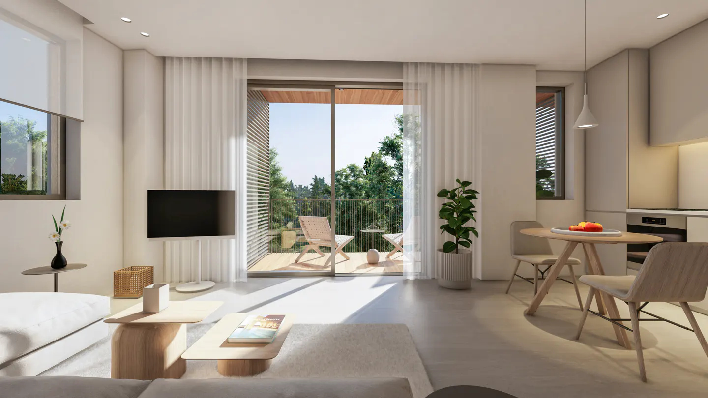 Bright, modern living room with white walls, light wood furniture, and a balcony with green trees visible through the open doors.